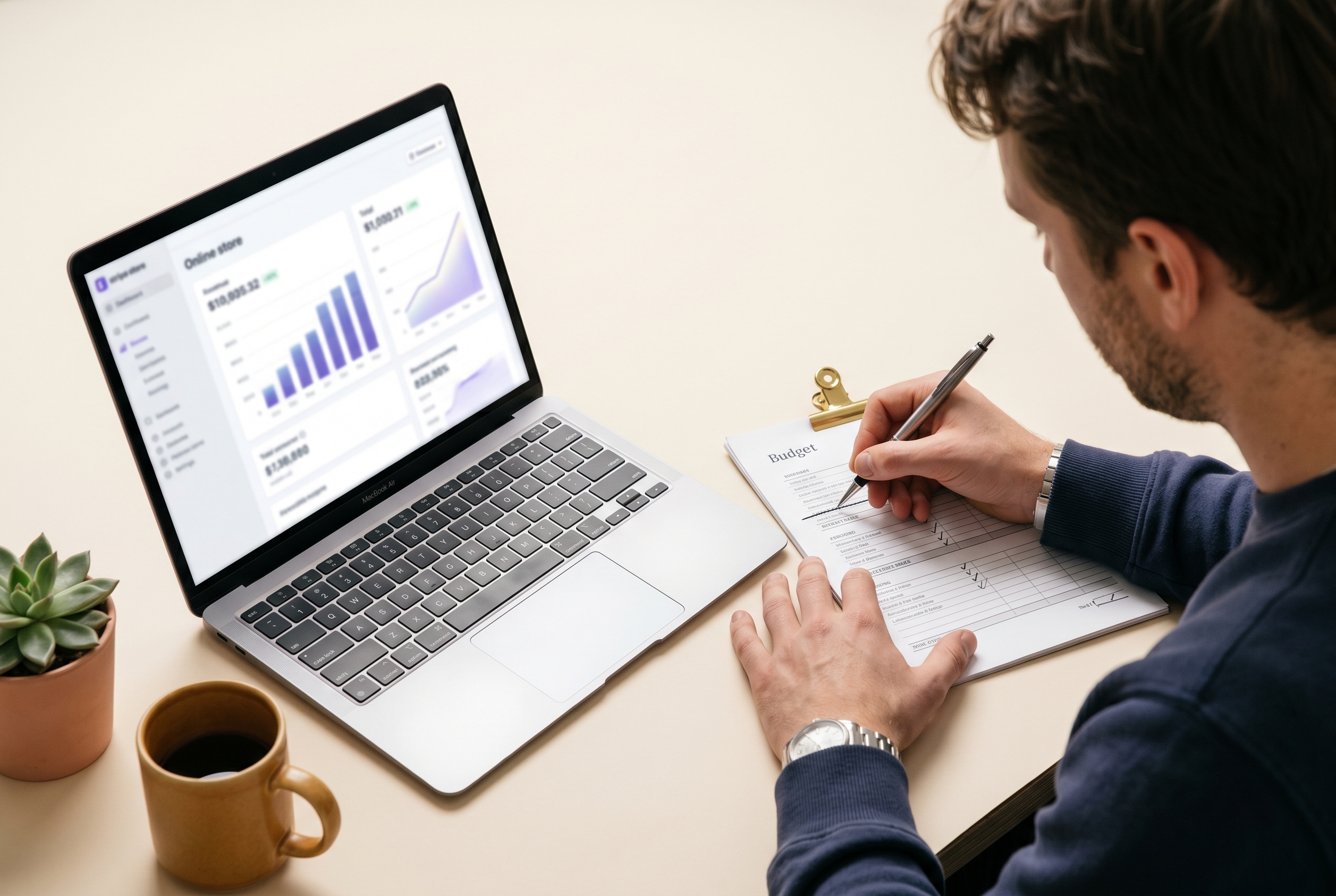 Entrepreneur trimming unnecessary costs from a budget sheet while their online store dashboard shows healthy revenue